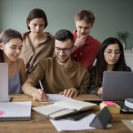 colleagues-using-laptops-notebooks-learning-study-session